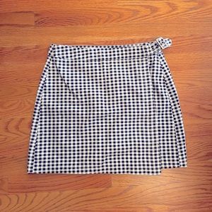 Black and white checkered skirt with buckle fasten